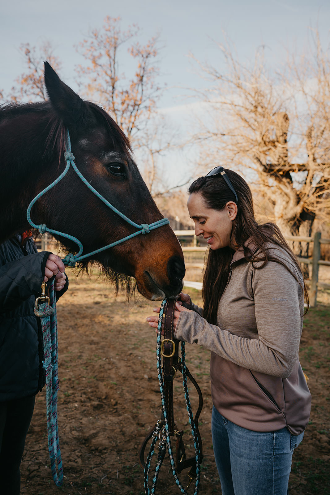 equine therapy branding photos of woman connecting with horse.