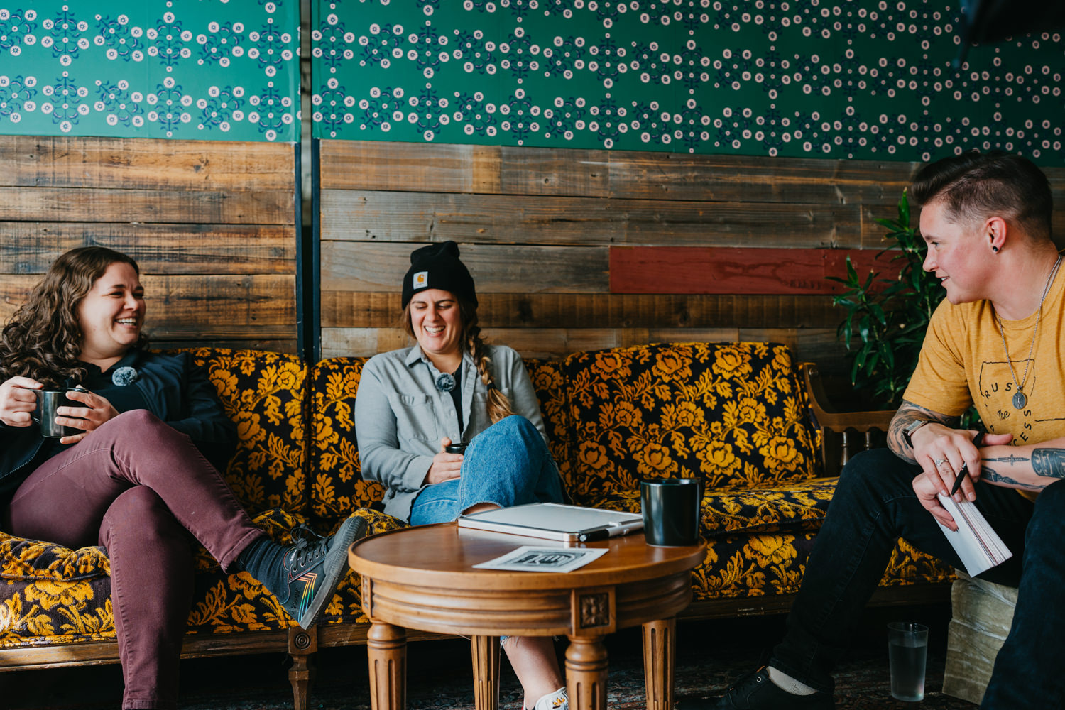 accessibility branding photo of people talking on couch.